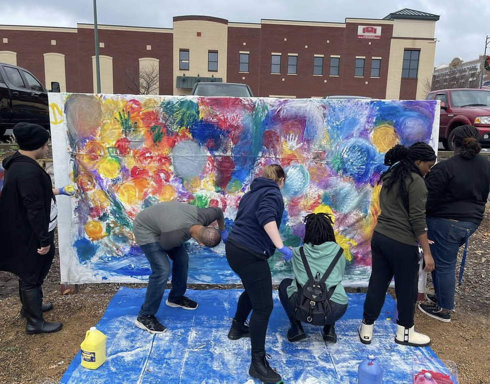 Students Work Together on the Community Mural